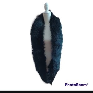 Fabulous furs black fauk fur with tribal material on the reverse side .